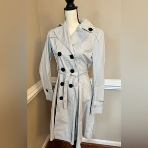 Beautiful trench coat with black buttons and matching tie belt